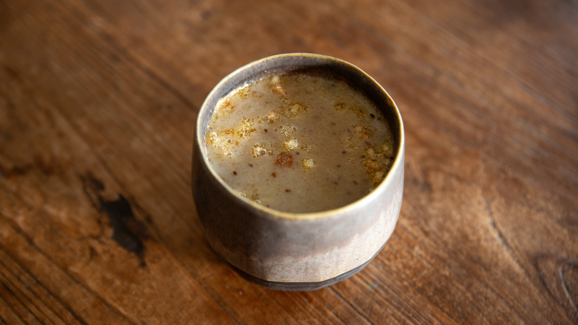 Warm rice porridge with ginger and fresh herbs